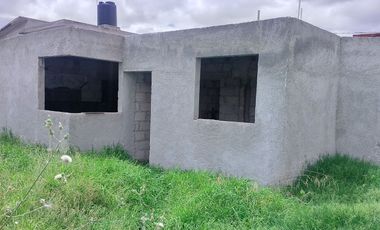 TERRENO CON CASA EN OBRA NEGRA EN PACHUQUILLA