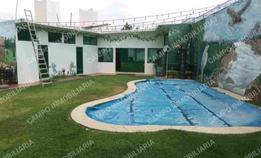 RENTA OCOTEPEC CASA CON ALBERCA CLIMATIZADA, PRIVADA CON DOBLE PORTÓN ELÉCTRICO PARA ACCESO.