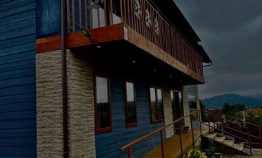 Parcela con propiedad y dos cabañas