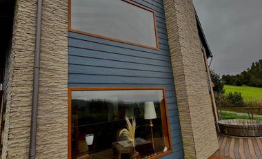 Parcela con propiedad y dos cabañas