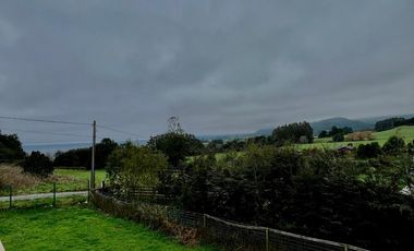 Parcela con propiedad y dos cabañas