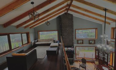 Parcela con propiedad y dos cabañas