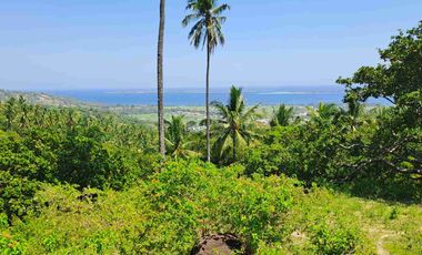 tanah dengan pemandangan laut dan sunset di pemenang dekat pelabuhan bangsal