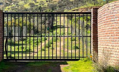 Leon Propiedades vende Parcela con casa en El Pangal, sector Alhué, Curacaví.