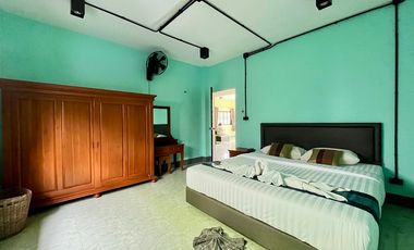 A private pool villa with 3 bedrooms and 3 bathrooms, along with parking space for 2 cars