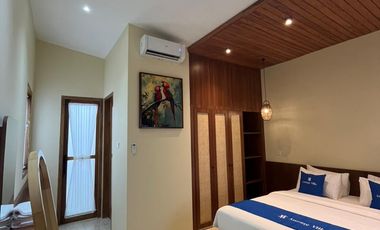 A Warm & Natural Family Space in Jogja, Featuring an Open Space Concept and Natural Materials