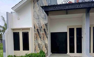 rumah cluster di komplek industri konveksi