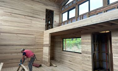 Vive Frente al MAR en Castro. Sitio urbano con casa en Puntilla Ten Ten