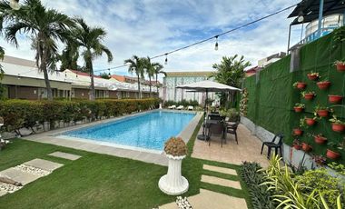 PRIME COMMERCIAL LOT WITH INCOME-GENERATING HOTEL — FOR SALE