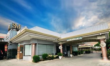 PRIME COMMERCIAL LOT WITH INCOME-GENERATING HOTEL — FOR SALE