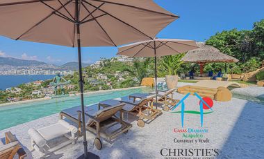 Casa con alberca con cascada, mesa de teppanyaki, palapa y vistas panorámicas al mar