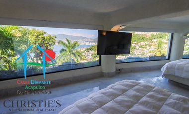 Casa con alberca con cascada, mesa de teppanyaki, palapa y vistas panorámicas al mar