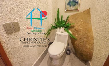 Casa con alberca con cascada, mesa de teppanyaki, palapa y vistas panorámicas al mar