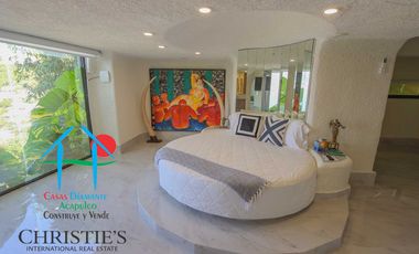 Casa con alberca con cascada, mesa de teppanyaki, palapa y vistas panorámicas al mar