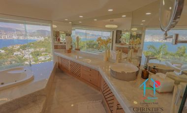 Casa con alberca con cascada, mesa de teppanyaki, palapa y vistas panorámicas al mar