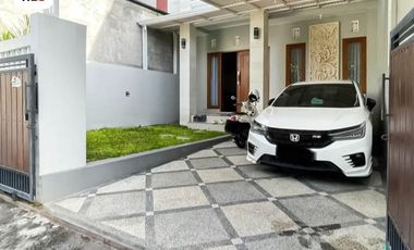 FOR SALE MODERN HOUSE WITH A BALCONY AND BEAUTY GARDEN AT DENPASAR