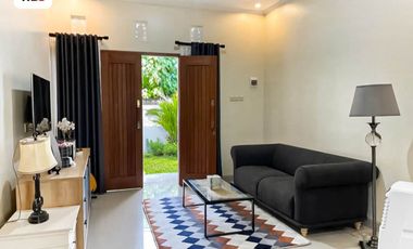 FOR SALE MODERN HOUSE WITH A BALCONY AND BEAUTY GARDEN AT DENPASAR