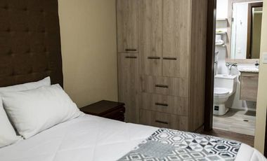 Casa de 3 dormitorios mas suite en el tercer piso con acceso independiente en el centro de Baños 2 parqueaderos