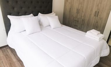 Casa de 3 dormitorios mas suite en el tercer piso con acceso independiente en el centro de Baños 2 parqueaderos