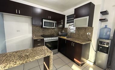 Casa en privada segura frente a CETYS | Semiequipada y con amplio patio