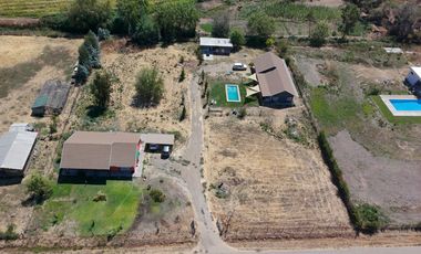 SE VENDE PROPIEDAD CON 2 CASAS EN SANTA RITA, PELARCO.