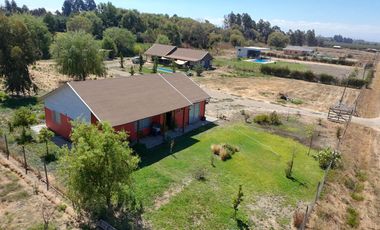 SE VENDE PROPIEDAD CON 2 CASAS EN SANTA RITA, PELARCO.
