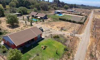 SE VENDE PROPIEDAD CON 2 CASAS EN SANTA RITA, PELARCO.