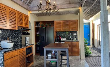 A beautiful semi-furnished villa with a small river, paddy fields and sunset view