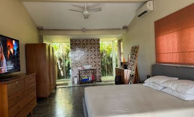 A beautiful semi-furnished villa with a small river, paddy fields and sunset view
