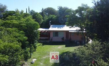Casa frente al río y bajada de lancha – Oportunidad en Los Espinillos, Potrero de Garay- 570