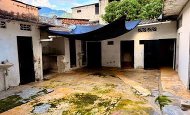 CASA LOTE A DOS CUADRAS UNIVERSIDAD DE IBAGUE BARRIO AMBALA CERCA AV