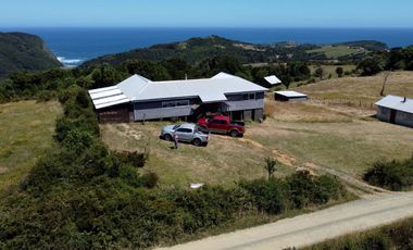 Parcela en venta con 2 casas a 500 metros del asfalto en Estaquilla