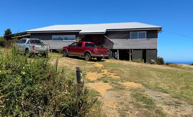 Parcela en venta con 2 casas a 500 metros del asfalto en Estaquilla