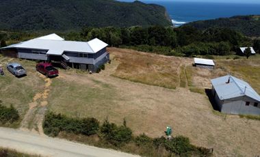 Parcela en venta con 2 casas a 500 metros del asfalto en Estaquilla