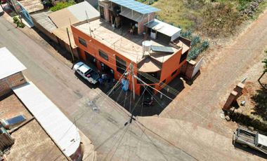 casa con negocio en funcionamiento