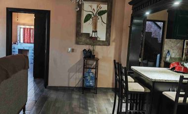 casa con negocio en funcionamiento