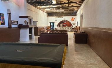 Venta de 17.800 m2 de terreno con 7 casas en Otavalo, apto para hostería