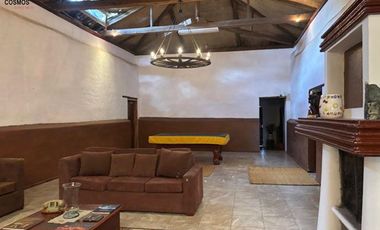 Venta de 17.800 m2 de terreno con 7 casas en Otavalo, apto para hostería