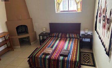 Venta de 17.800 m2 de terreno con 7 casas en Otavalo, apto para hostería
