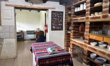 Venta de 17.800 m2 de terreno con 7 casas en Otavalo, apto para hostería