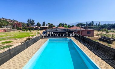 Leon Propiedades vende parcela con gran piscina olímpica y quincho en sector El Ajial, Curacavi.
