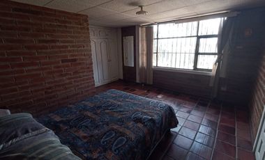 Vendo un Terreno con Casa en Pifo