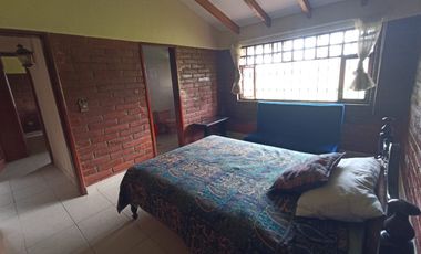 Vendo un Terreno con Casa en Pifo