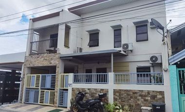 PREOWNED MODERN TWO-STOREY HOME IN A VILLAGE ALONG MCARTHUR HWAY SAN FERNANDO
