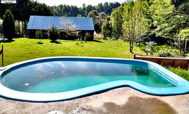 EN VENTA AMPLIA CASA CON CABAÑA Y GALPON EN PARCELA