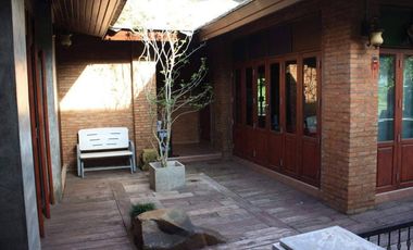 Explore this captivating Lanna-style Thai house for sale in the center of Chiang Rai.