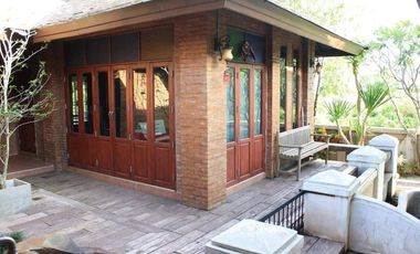 Explore this captivating Lanna-style Thai house for sale in the center of Chiang Rai.