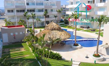 Departamento en condominio con club de playa. Terraza con vista a la alberca