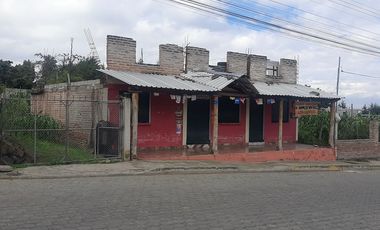 CHECA, vendo terreno 1.500m, con casa y local comercial, servicios básicos
