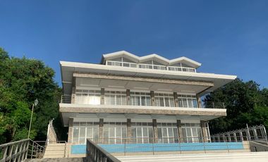 For Sale: Glass Beach House in Compostela with Foreshore Lease